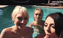 Young women giving oral pleasure in a swimming pool